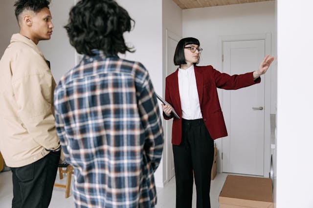 a%20landlord%20showing%20two%20tenants%20around%20a%20property